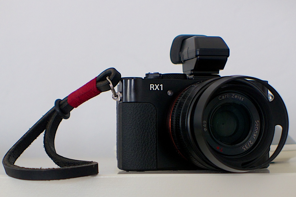 My bargain second-hand Sony RX100 with Gordy leather wrist strap (small), £5 Amazon lens hood and Sony