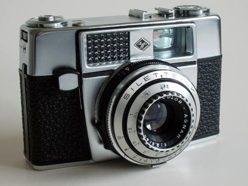 This, I am fairly sure, is similar to the camera I bought in 1963. It is the Silette-LK and came with a variety of optional lens and shutter configurations. Note the light meter window, top left. Photograph from Camerapedia.com from Süleymandemir