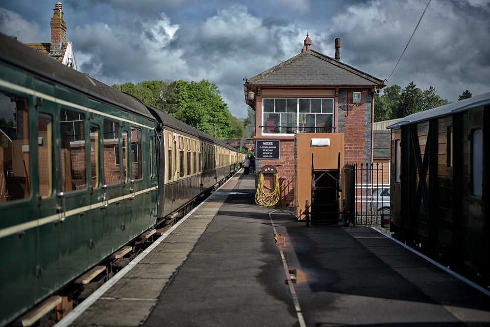 Storm clouds gather over Bishops Lydeard station at the southernmost end of the West Somerset Railway. Norton Manor steaming at the head of the train