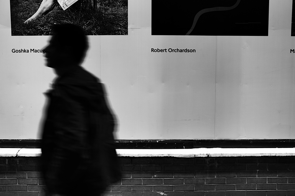 ISO 500, f/1.4 at 1/60s to blur the silhouette. Â