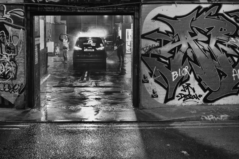 ISO 4,000, f/1.4 at 1/360. This is an interesting comparison between the low-lit graffiti wall and the more brightly lit interior of the car wash. Note the impressive detail inside