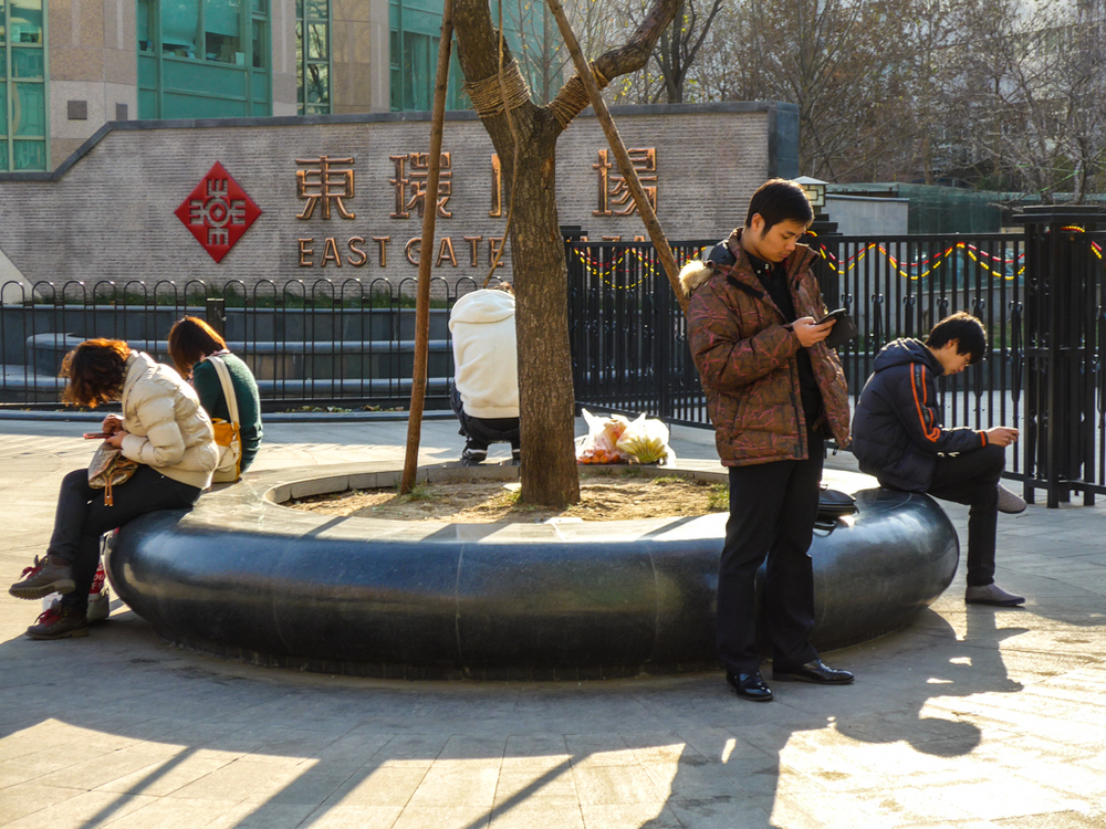 Where East meets the smartphone, the same the world over. The Leica C makes a successful street tog tool