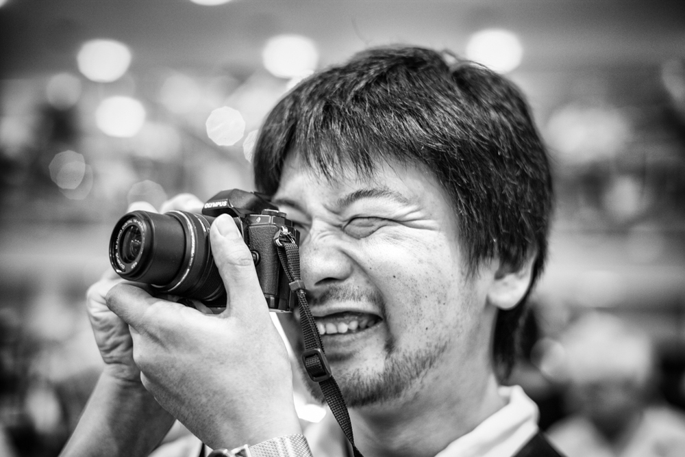  The nifty, decidedly non-vintage Olympus OM-D M10, is a real miniature DSLR lookalike. Its Japanese owner, studying design in London, had bought himself a large wooden vintage tripod and plans to turn it into a piece of furniture.   