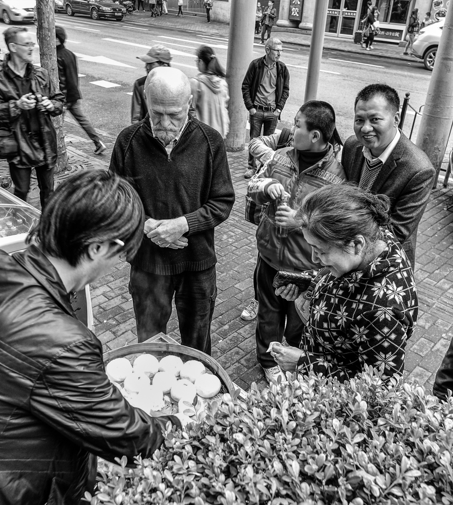 孔老夫子, Old Confucius, who also answers to Brad, buys a bag of ¥1 buns (black and white conversion by Mike Evans)