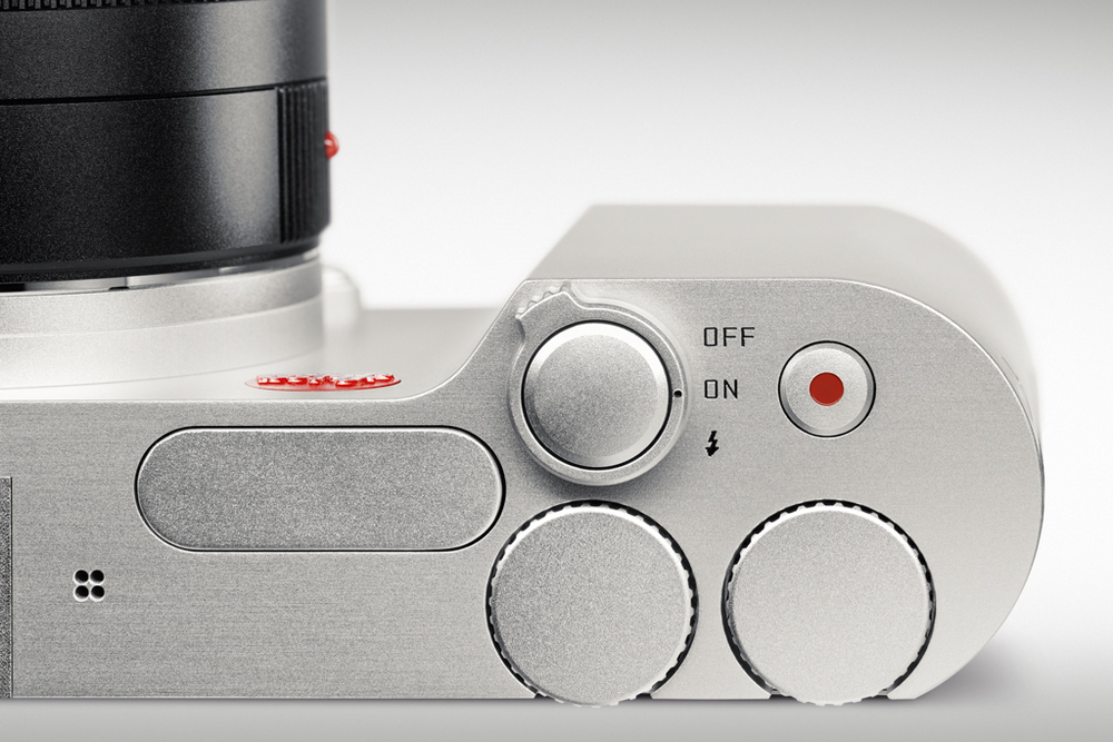 J ust four things to fiddle with on this camera: The multi-function off/on/flash/shutter control, the video button and the two customisable dials. To the left is the small pop-up flash with its 4.5 guide rating