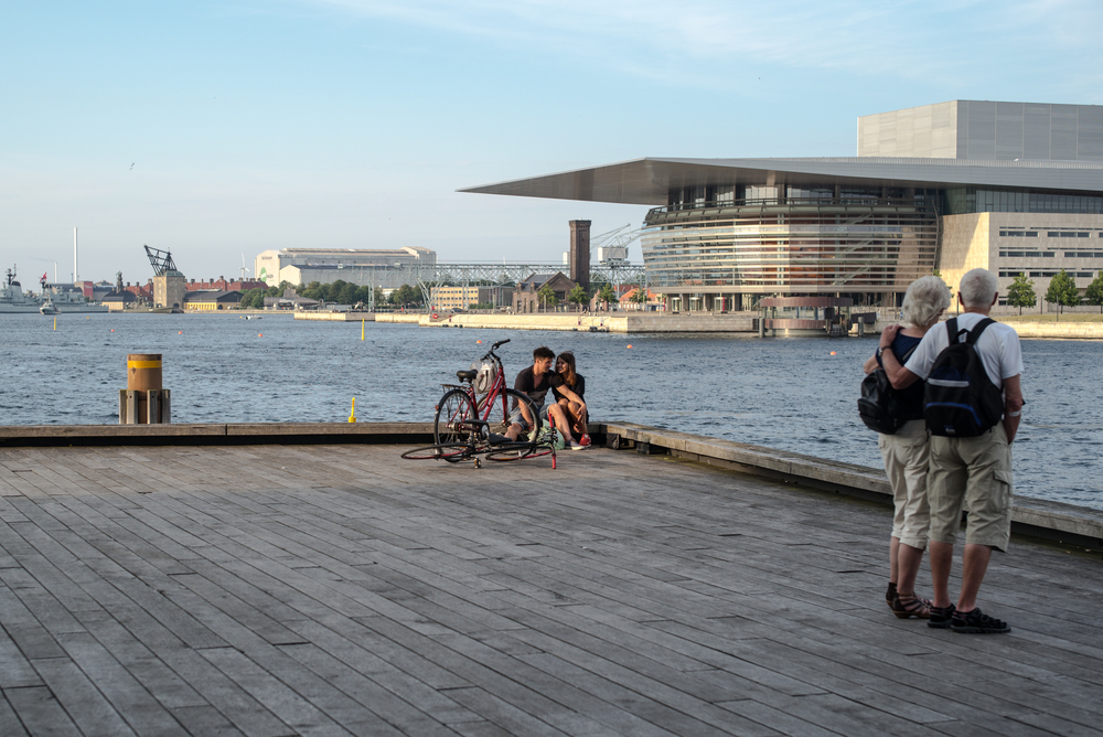   Two by two, a lifetime apart,  against the background of the  opera house,  Leica M, 50mm Summilux  