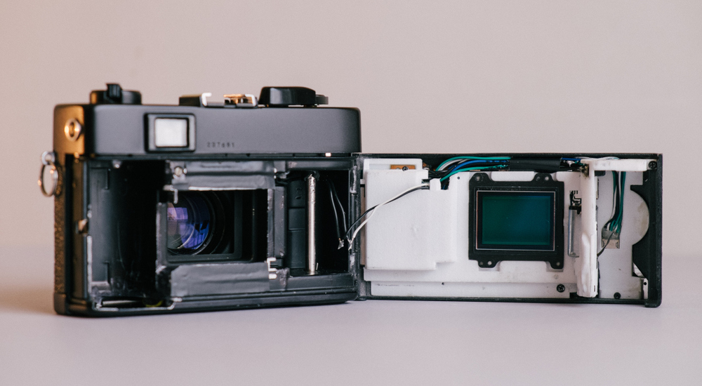 Inside the Konica showing the 3D-printed housing for the electronics with the sensor mounted on the front
