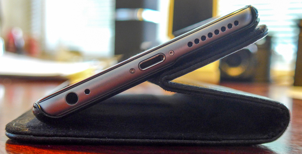 There is no adjustment for the angle of view and the phone slides down to achieve this angle. It is possible to place an object under the fold to create a steeper angle