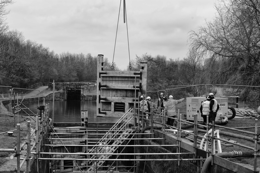 Lock gates, identical to the original 200-year-old constructions, are lowered into place