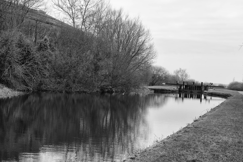 Looking down from Cale Lane bridge towards Lock 67 (Wigan Lock No. 3) below which are a further 20 locks before Wigan Pier