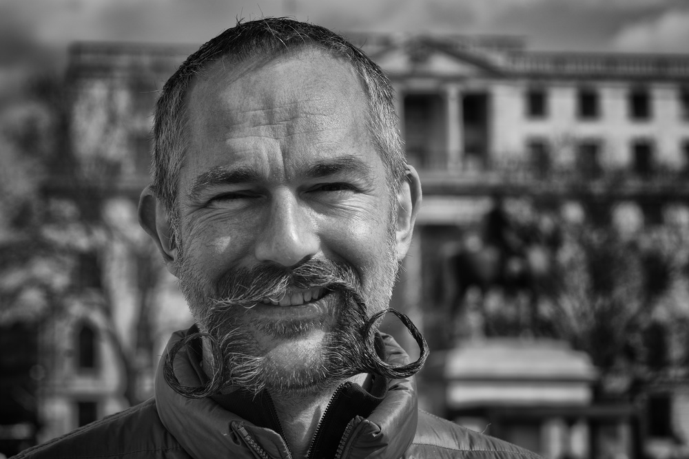 75mm or even 90mm lenses are not too subject-remote as to be impersonal. You are still close enough to have a chat and ask permission, as I did with this splendid moustachioed gent in Trafalgar Square on Easter Sunday. This is taken with my wonderful 75mm Leica Apo-Summicron perched on a Sony a7II body (at f/8)