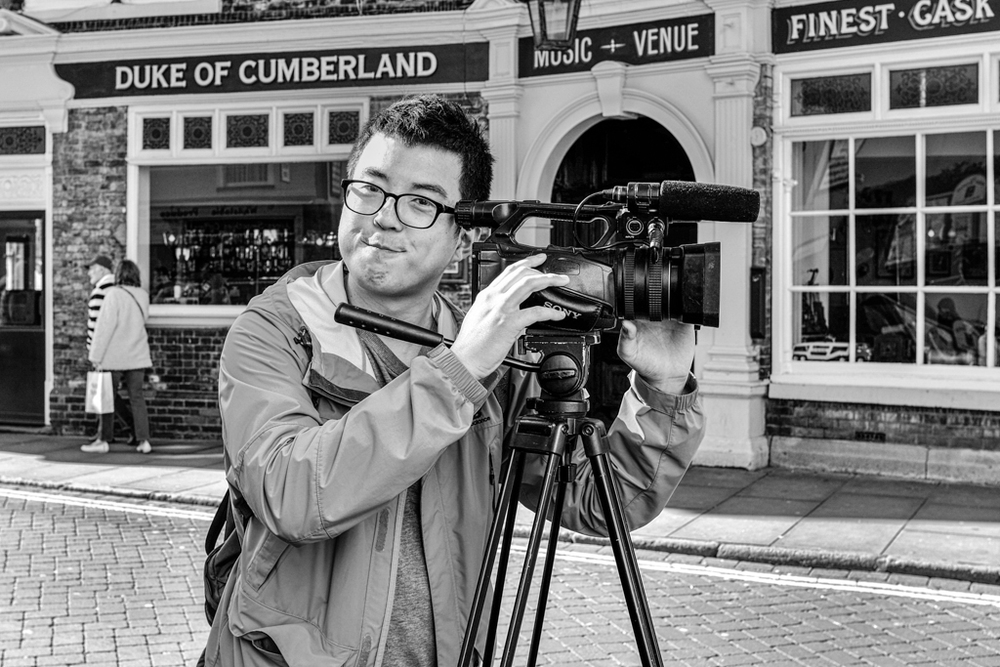 These pictures are both taken with the Fuji X100s and its fixed 35mm-equivalent focal length lens. Use of f/8 (above) achieves an impressive depth of field with such a wide lens and is ideal for street work. Close-up portraiture, however, demands care to avoid unflattering distortion as illustrated below