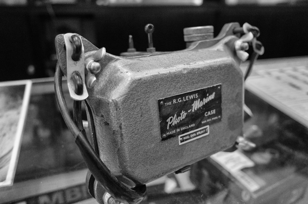   Rear of the case with enormous wing nuts and the R.G.Lewis trademark. See also the heavy-duty rubber-covered strap  