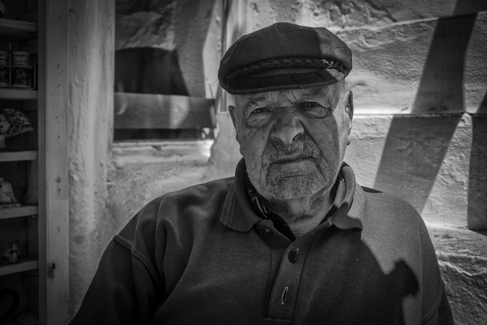   Above: Nikos has managed his little souvenir store in Matogianni Street since the 1960s and lives at the back of the shop with 