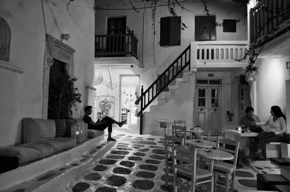   Above: Evening relaxation at Bubbles Champagne Bar in the square of Agios Vlassis near the Old Port (Ricoh GR). Below: Capturing the famous Myconian sunset at the Old Port beach (Ricoh)  