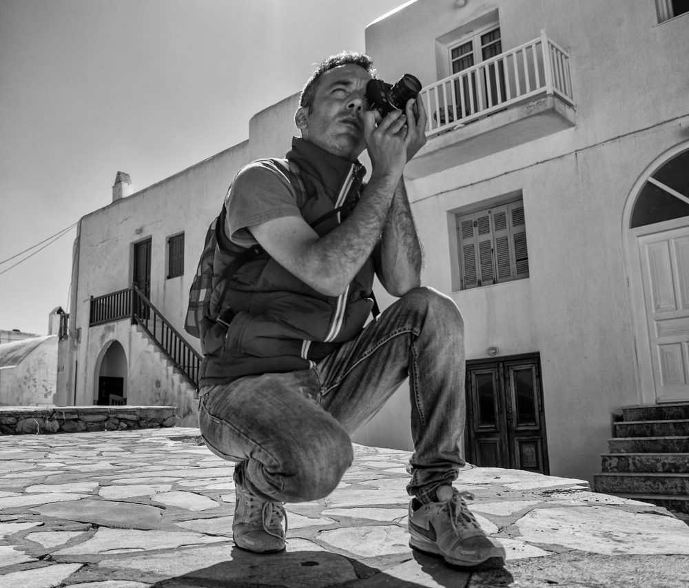 A few hours with a camera in Mykonos soon provides enough fodder to fill a small SSD. Yesterday I was out with two local photographer friends, Kostas Tolias and Vlasis Hatzialexandrou (above with his 2007 Leica M8 which he has owned from new). Being part of a group encourages more activity and overstocked SD cards (Photo Mike Evans, Ricoh GR)