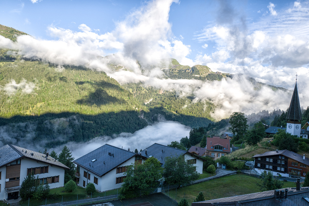 Morning in the village of Wengen with low-lying clouds settling into the Lauterbrunnen valley