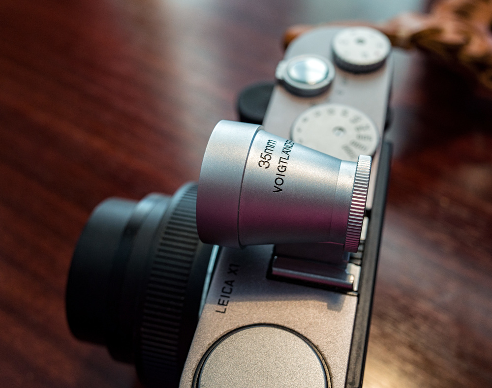 The X1 is an object of beauty and the Voigtländer 35mm finder is its perfect complement. Forget the fussy X2 with its unsightly hump and grab yourself a future classic