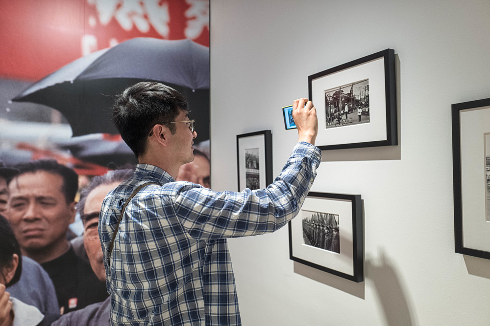 My friend Michael Zhang , an accomplished photographer from Sydney, shares an umbrella with Chou En-lai