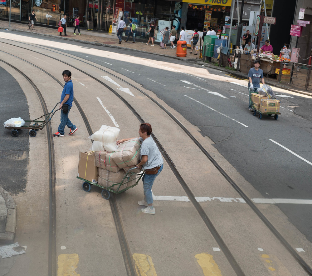 It is absolutely obligatory to get a picture of a man pushing a cart across a busy junction. All visitors to Hong Kong know this. So I