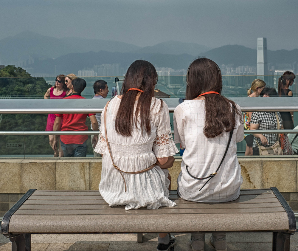 Ladies in white, and a city vista