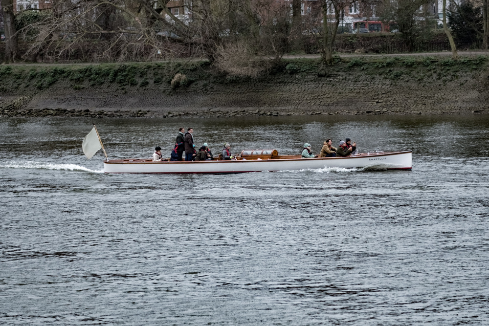 The following launch Amaryllis gives little away with its Thames-grey legendless pennant, but there is at least one passenger in Cambridge colours.