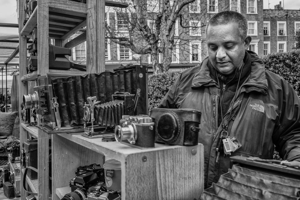  Juliano tending his well-stocked photographic stall (Photo Mike Evans, Leica M-P and 28mm Elmarit) 