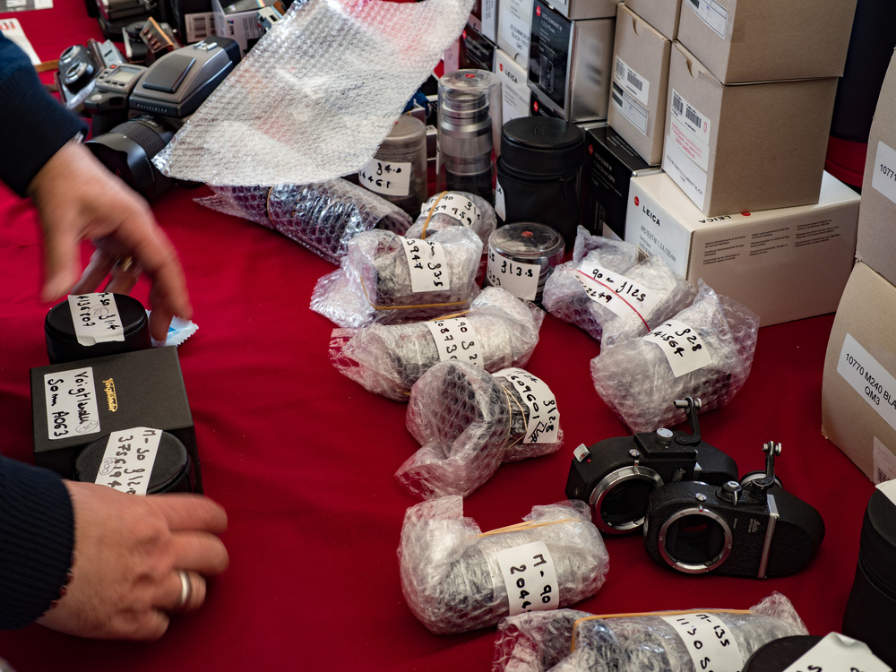 A British dealer assembling a stock of lenses for purchase