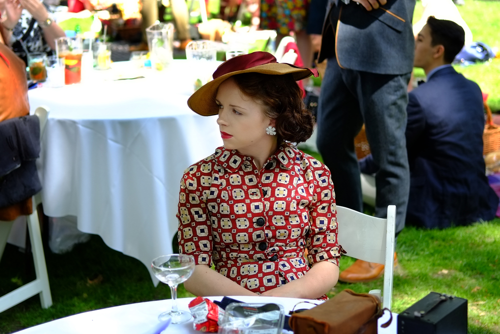 Chap widow with Box Brownie and sadly empty glass