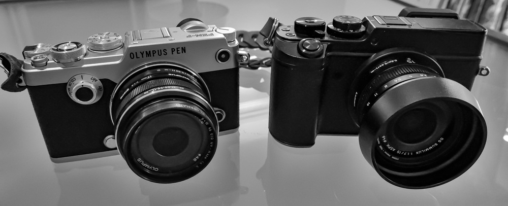 Olympus PEN-F (with Oly 17mm f/1.7) compared with the Panasonic Lumix GX8 with the Leica DG 15mm f/1.7. The Olympus lens has that brilliant push-pull focus clutch with a helpful depth-of-field scale in the manual position. The Leica lens makes do with a simple AF/MF switch but adds a beautifully smooth and precise manual aperture ring.