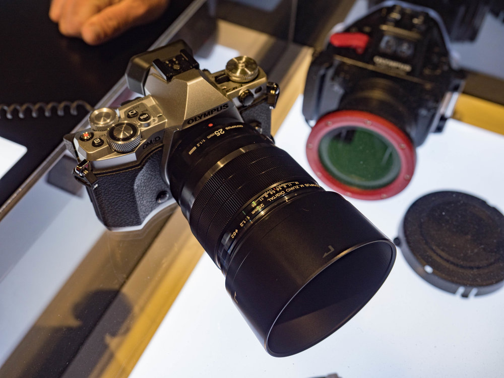 The fast f/1.2 25mm Pro lens from Olympus is a big beast, much larger than the Panasonic/Leica 25mm Summilux. It closely follows the styling and ergonomics of all the latest Olympus pro lenses.