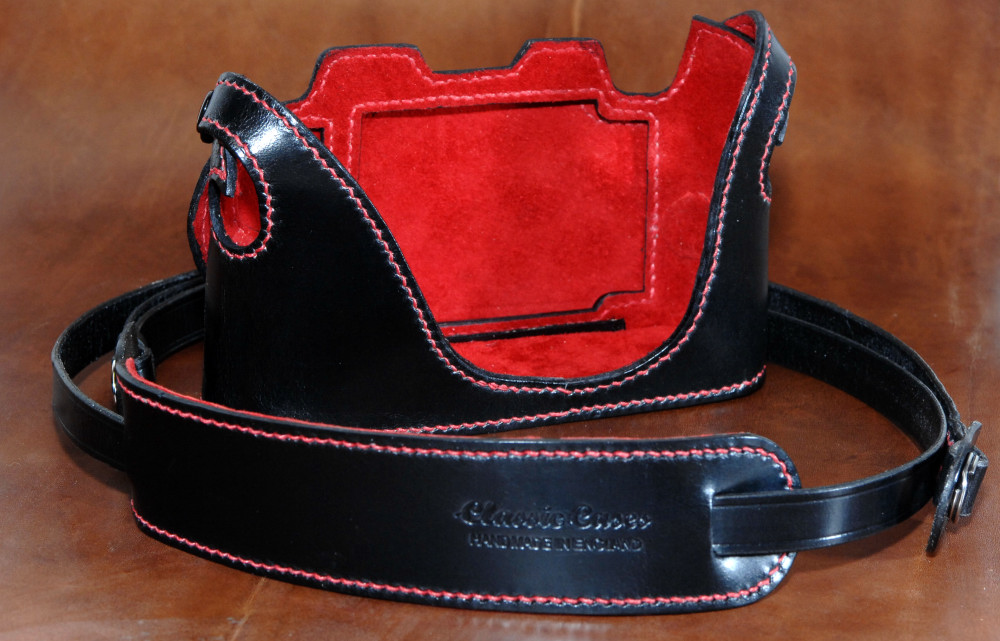 Black leather Leica case and strap with red lining and detailing. Paul is always happy to quote for special orders such as this.