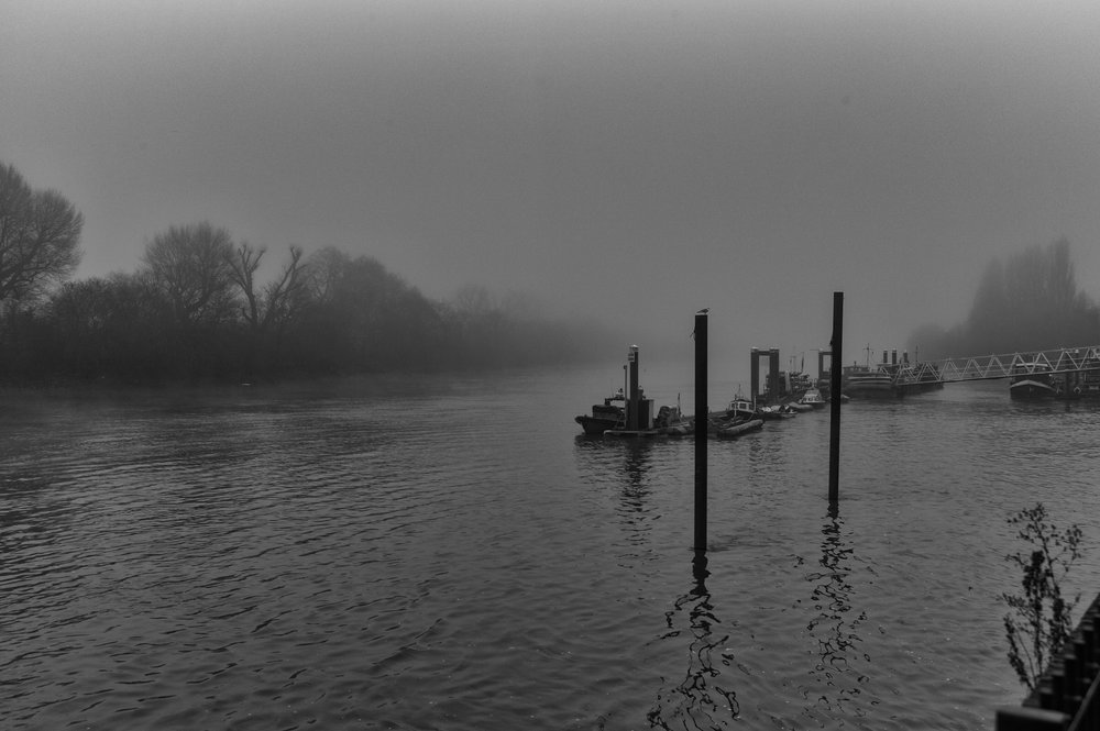 Lifeboat station at Chiswick Pier shrouded in typical winter mist