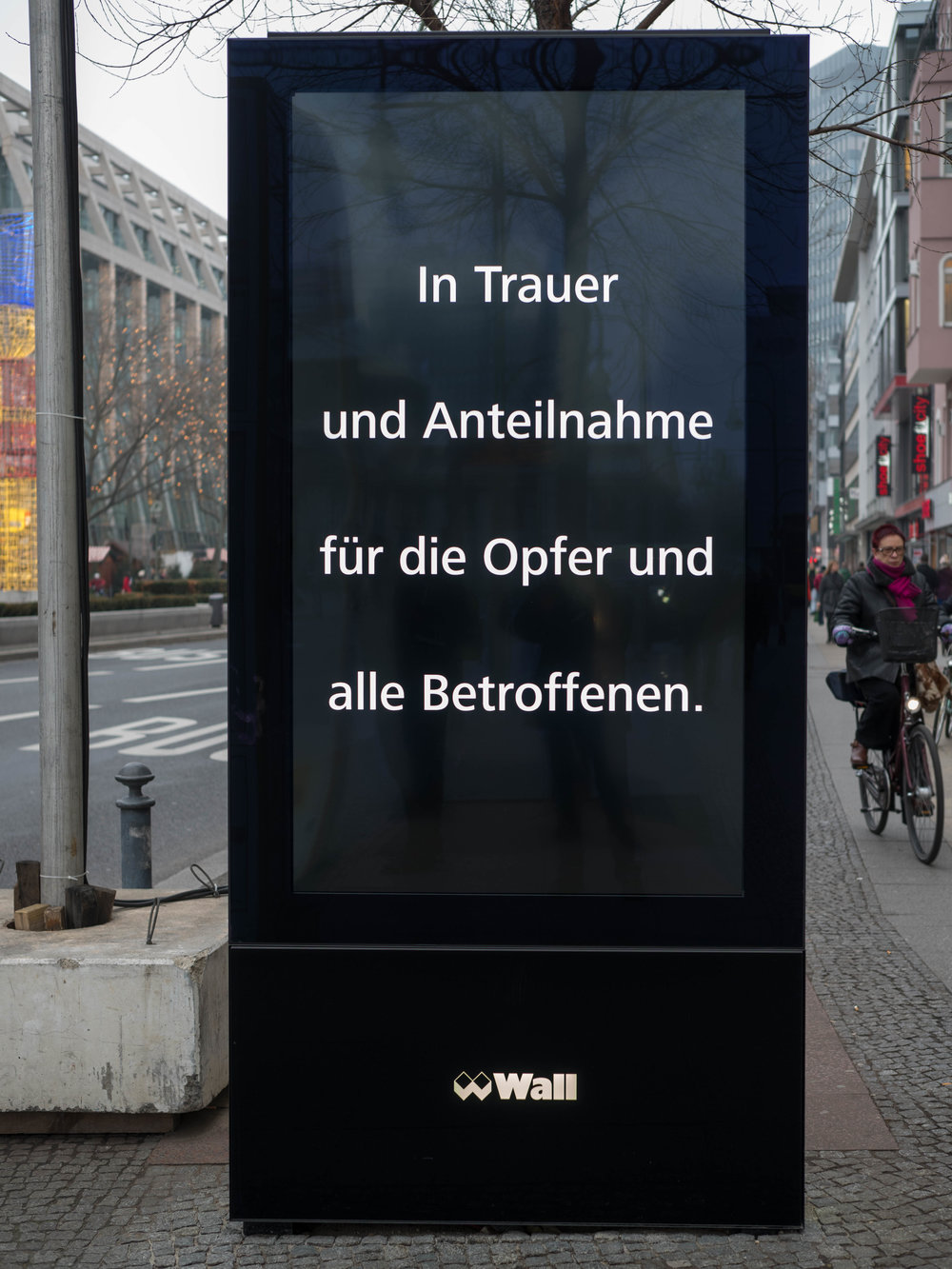 A simple message of sympathy replaces all the advertising displays in the city