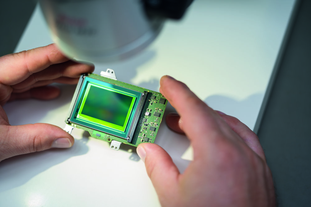 Sensor surface and coating are visually examined for scratches, dust and air pockets