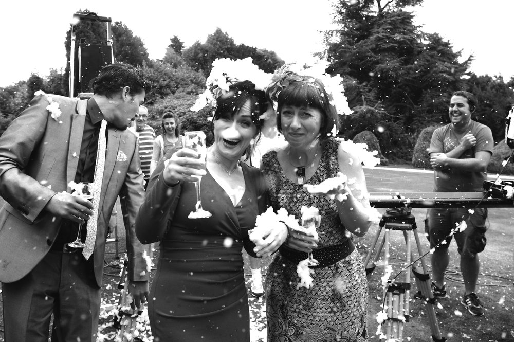 A snow machine gone mad. Dido Miles and Sarah Moyle get attacked by fake snow in a scene from the BBC