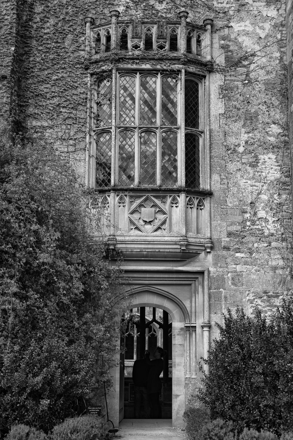 The famous oriel window seen from outside the Abbey. The cloister can be glimpsed through the archway