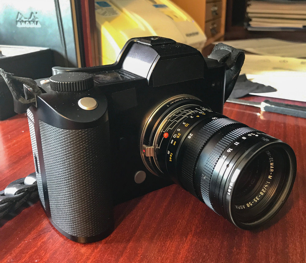 My SL lightened considerably with the mini M-zoom, the Leica Tri-Elmar which offers three discrete focal lengths of 28, 35 and 50mm. This is a rig that makes sense from a size and weight point of view. (iPhone 7 Plus)