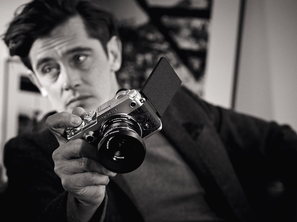 The Olympus PEN-F is a gorgeous retro camera — much more interesting to behold than the plain-Jane Panasonic GX80. But it does come at a hefty price