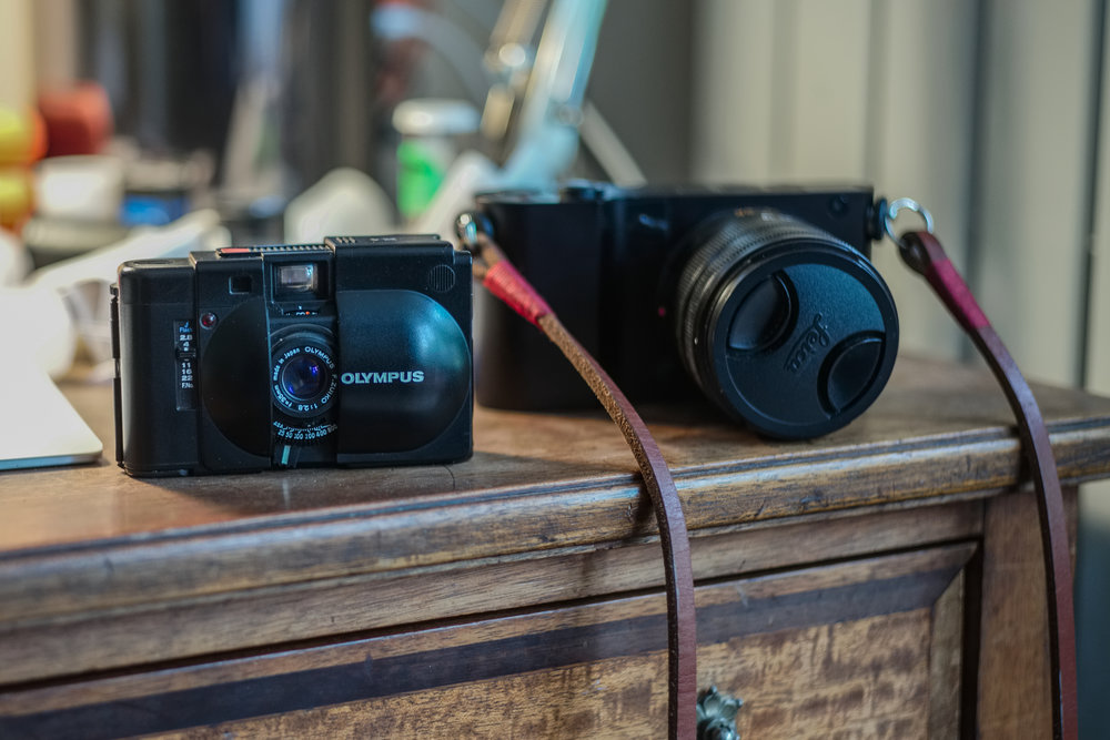 Temporary nirvanah — the Olympus XA has a lot more potential as a pocketable film camera. It has a 35mm fixed f/2.8 lens and proper rangefinder focus. And the bashed-up Leica T is proving to be a great digital contender