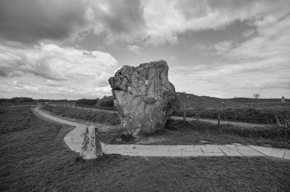 Dramatic landscapes benefit from a wider angle. Ancient stone at Avebury, Wiltshire, taken at 11mm, f/3.5