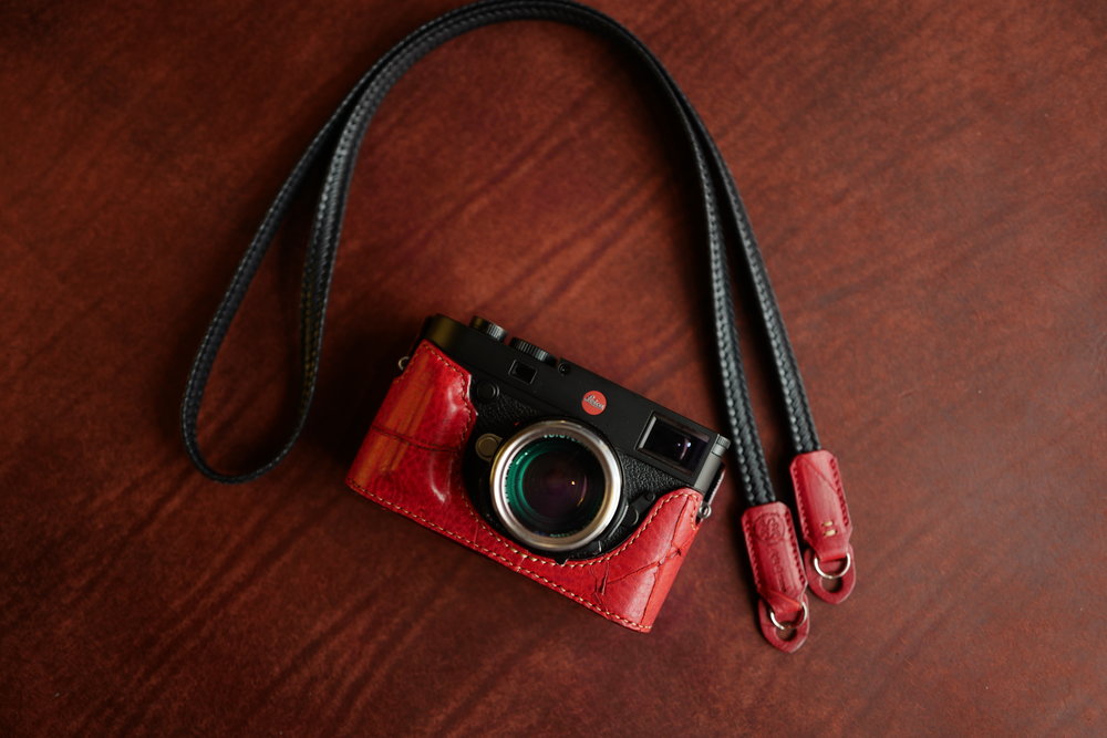Bold red with complementary black/red waxed-cotton strap, standard grip