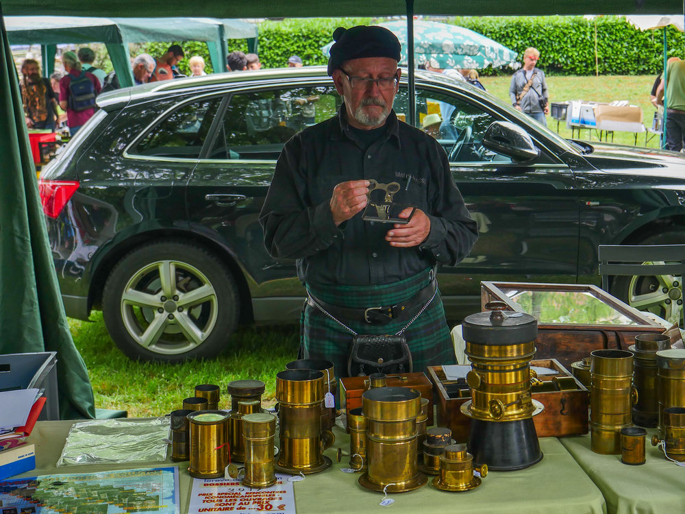   Jean-Loupe Princelle,  noted author  and authority on old brass lenses, who not only wears the kilt but keeps a pair of bagpipes handy for quiet moments  