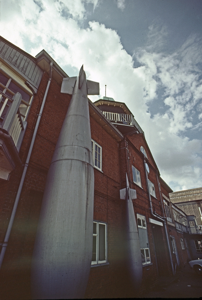   Boys and their toys: The Barnes Wallis-designed  Grand Slam bomb  propped up against his office in the old clubhouse. The dambusting bouncing bomb, which resembles an oil tank, is not in evidence but there is an example on show at the Brooklands Museum today  