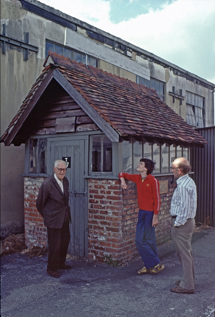   My son Peter (centre) propping up the 1911 air ticket office in its original location, well before it was declared an Ancient Monument.   On the left is Bob Dicker who not only won over 100 races at the track, but also worked for Vickers and was the aircraft rigger for Alcock & Brown