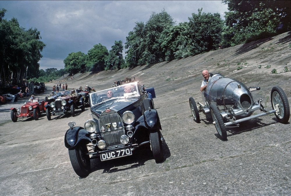   The start of the Reunion Parade of pre-war exotica on the ancient 1907 banked circuit  