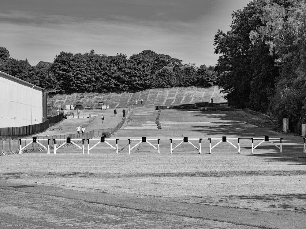   The famous finishing straight, scene of countless victories between 1907 and 1939, is now rescued after 77 years hosting a massive and very ugly wartime aircraft hangar. The smart new hangar can be seen to the left and, in the distance, is a section of the banked circuit (42.5mm Leica DG Nocticron)  