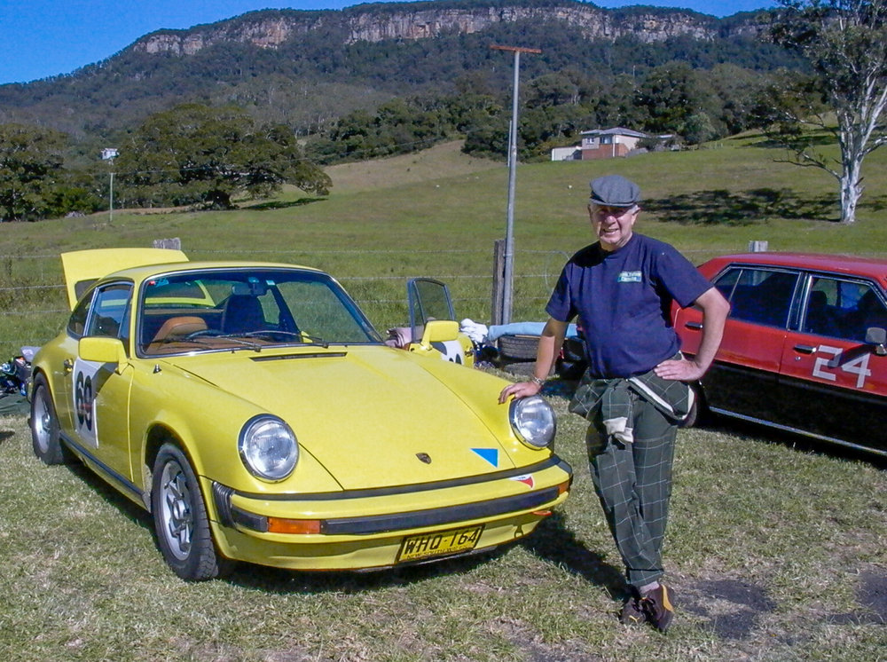 John Sr. and one of his beloved Porsches