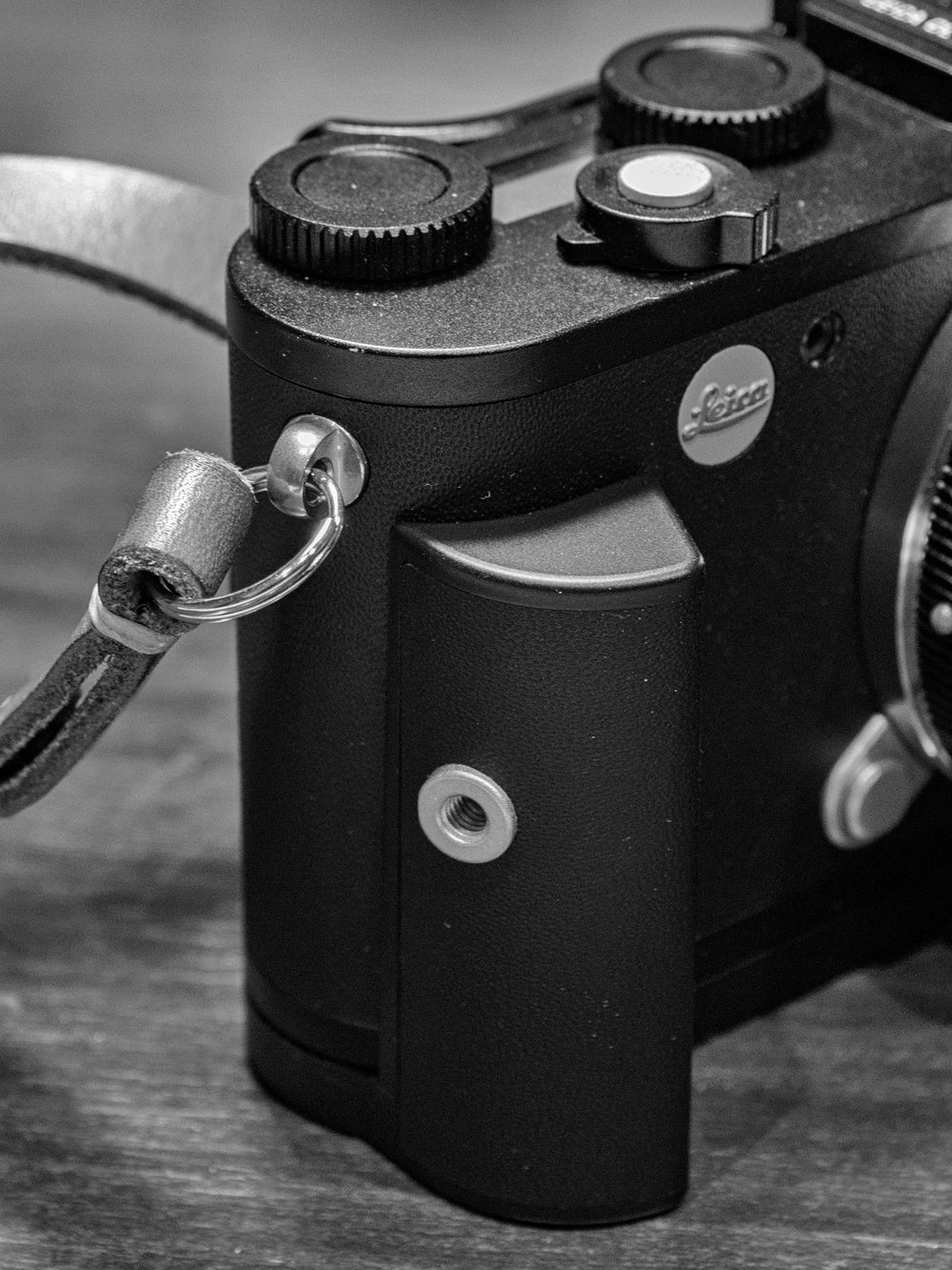   The grip portion is relatively short, in sympathy with the low camera height, but offers good support and makes the camera more comfortable to hold. Note the threaded socket for the optional rubber finger loops  