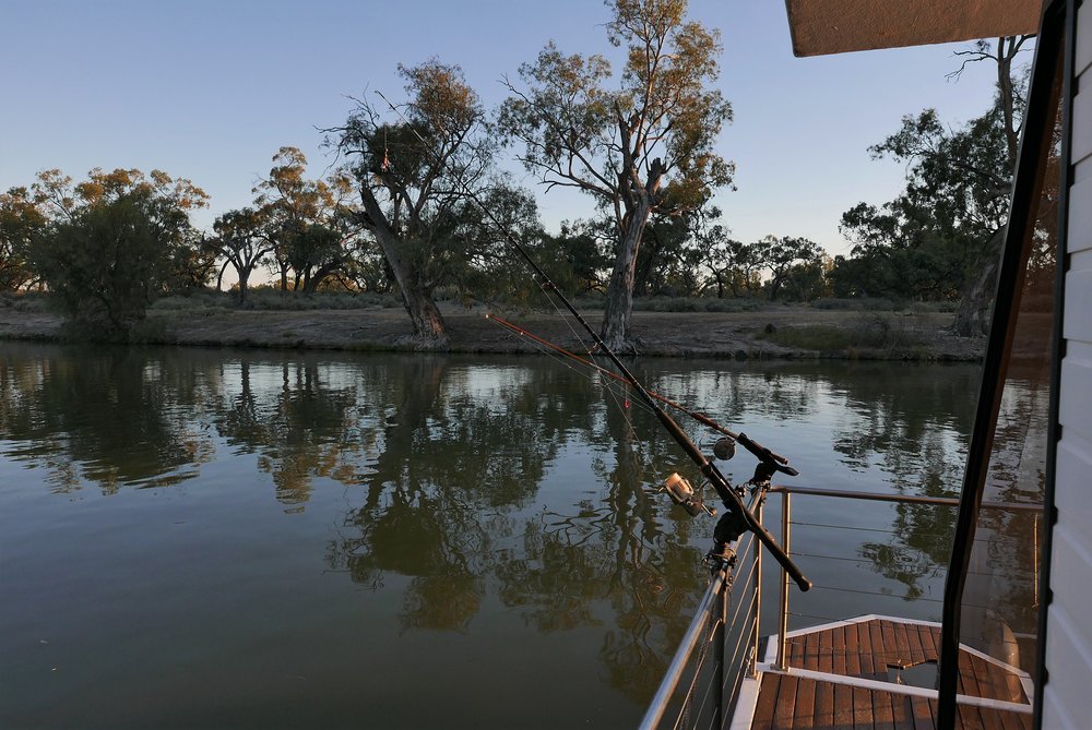   Evening light, deserted fishing rods, just too hot  